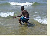 Photo of boy in water at beach
