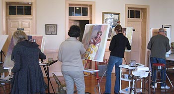 Atelier students painting in workshop