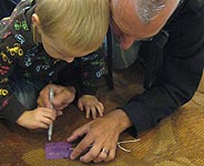 Dad and son filling out a Hope Card