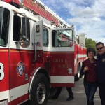 Hometown Hero artist, Pamela Alderman, arrived riding in Grand Rapids Fire Dept Engine #3