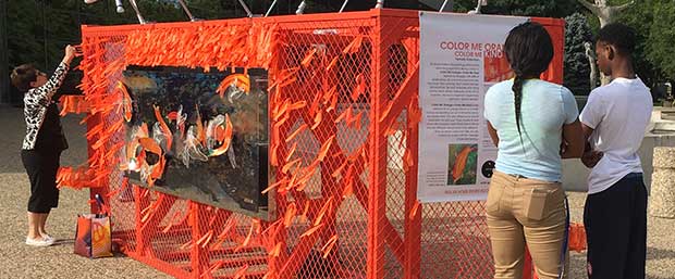 Color Me Orange—Color Me Kind installation at the beginning of ArtPrize Eight