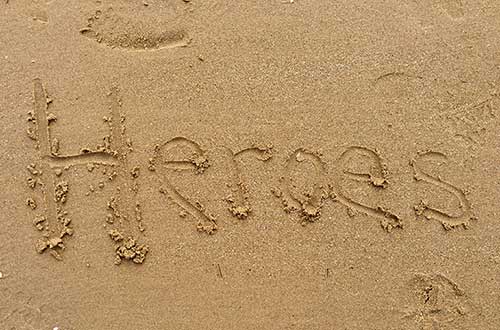 Heroes written in beach sand