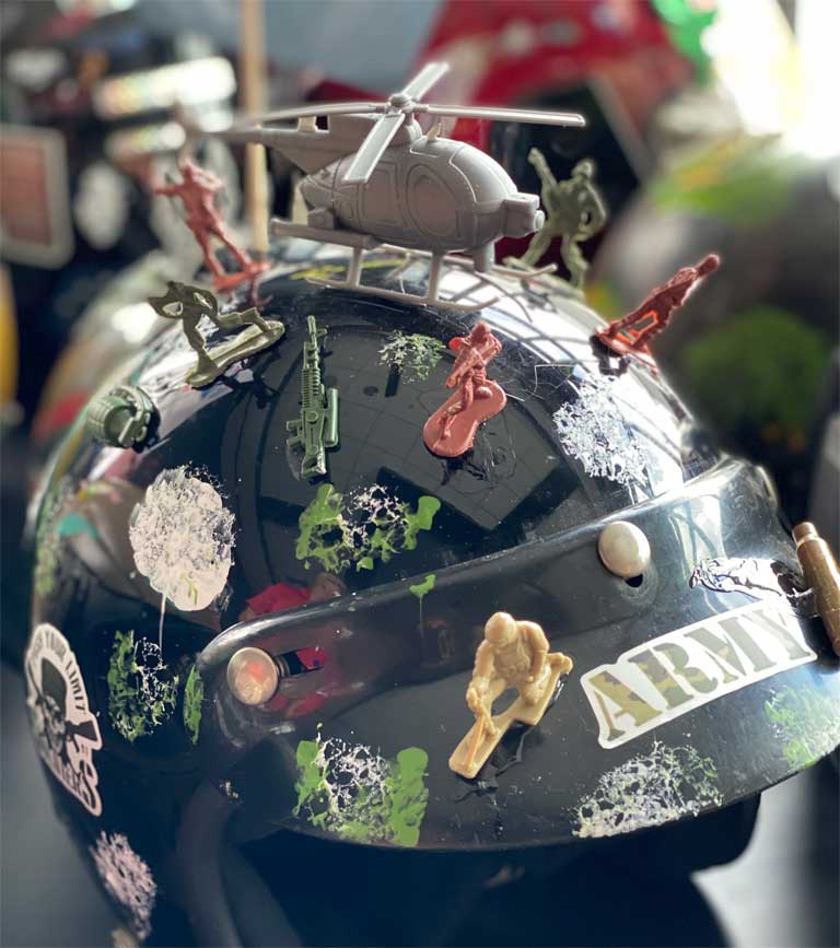 Close-up of decorated Stories of Service veteran art helmet